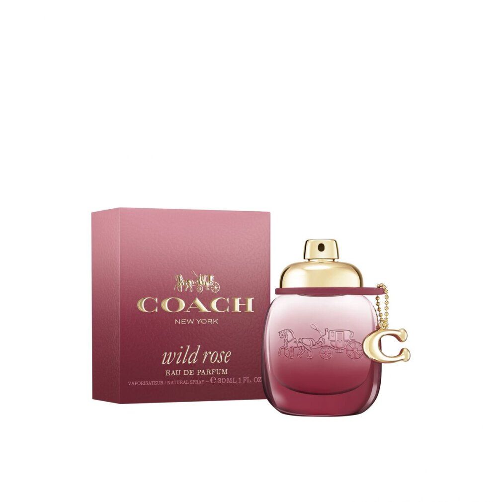 Coach Wild Rose EdP Nat. Spray. Flakon und Verpackung in Rosa. Goldfarbener Verschluss und Anhänger.