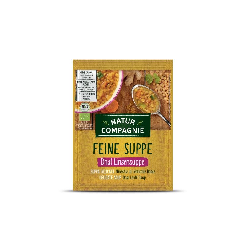 Verpackung von Natur Compagnie Feine Suppe Dhal Linsensuppe. Aufschrift: Bio, glutenfrei, vegan. Abbildung von Suppe mit Linsen.