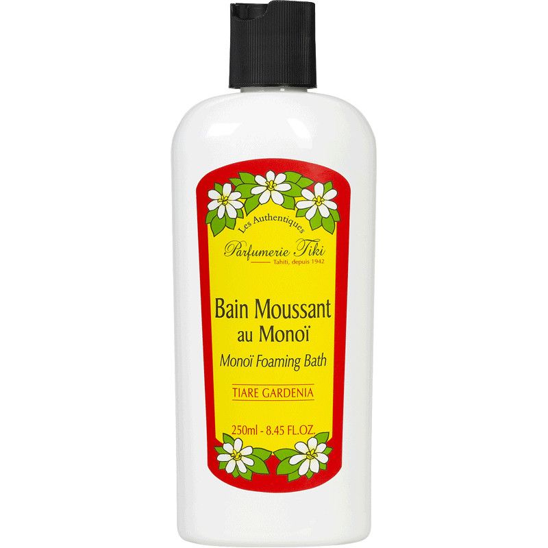 Weiße Flasche mit schwarzem Deckel. Etikett mit Text: Bain Moussant au Monoï, Tiare Gardenia. Marke: Parfumerie Tiki.