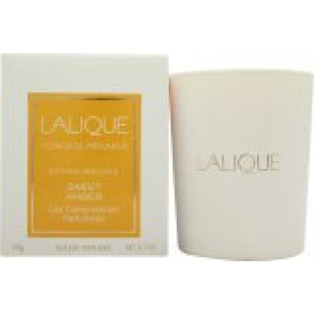 Weiße Kerze und Verpackung. Goldfarbener Schriftzug "Lalique". Auf der Verpackung "Sweet Amber".
