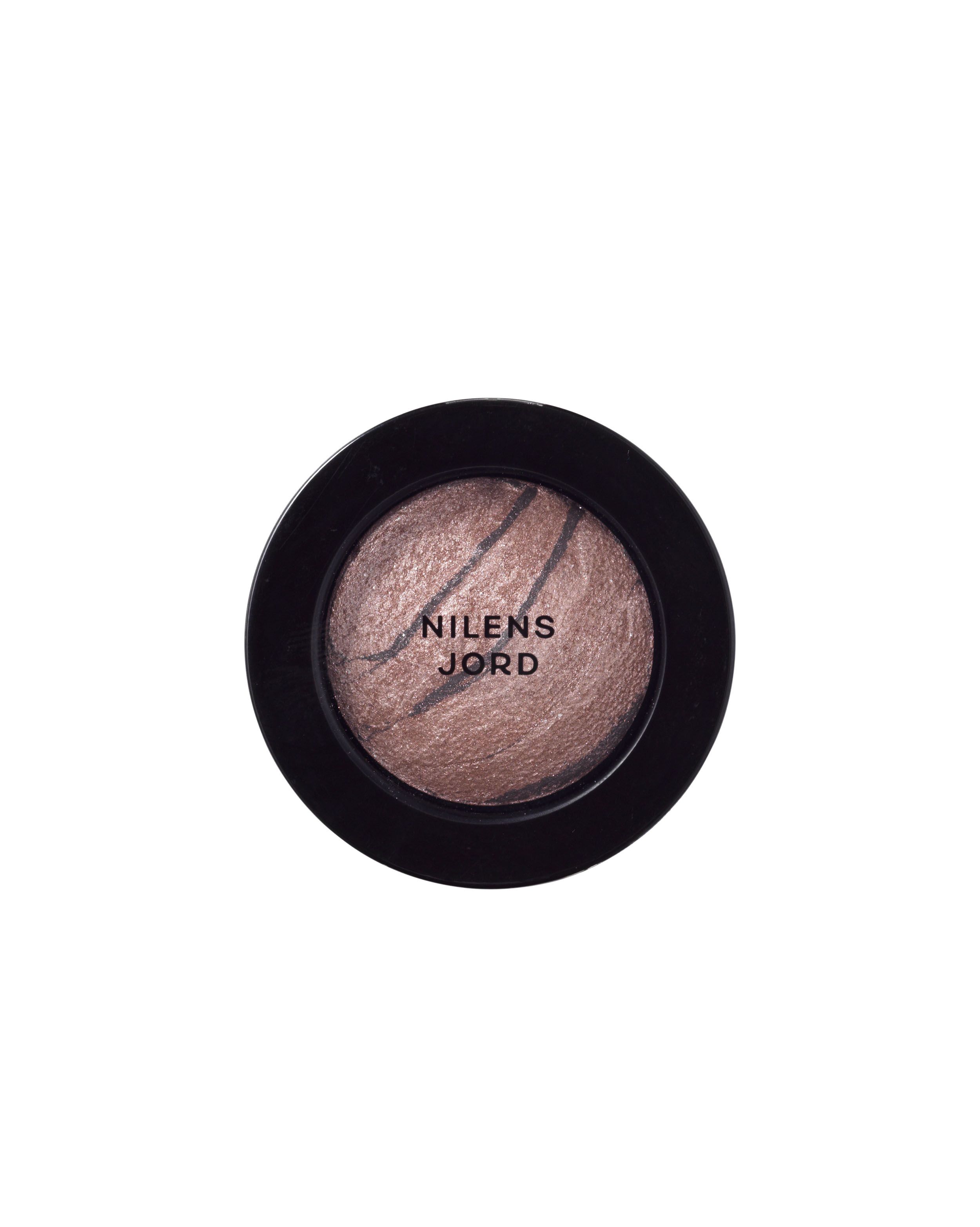 Nilens Jord Baked Mineral Eyeshadow in einem schwarzen Behälter mit offenem Deckel. Die Oberfläche ist marmoriert.