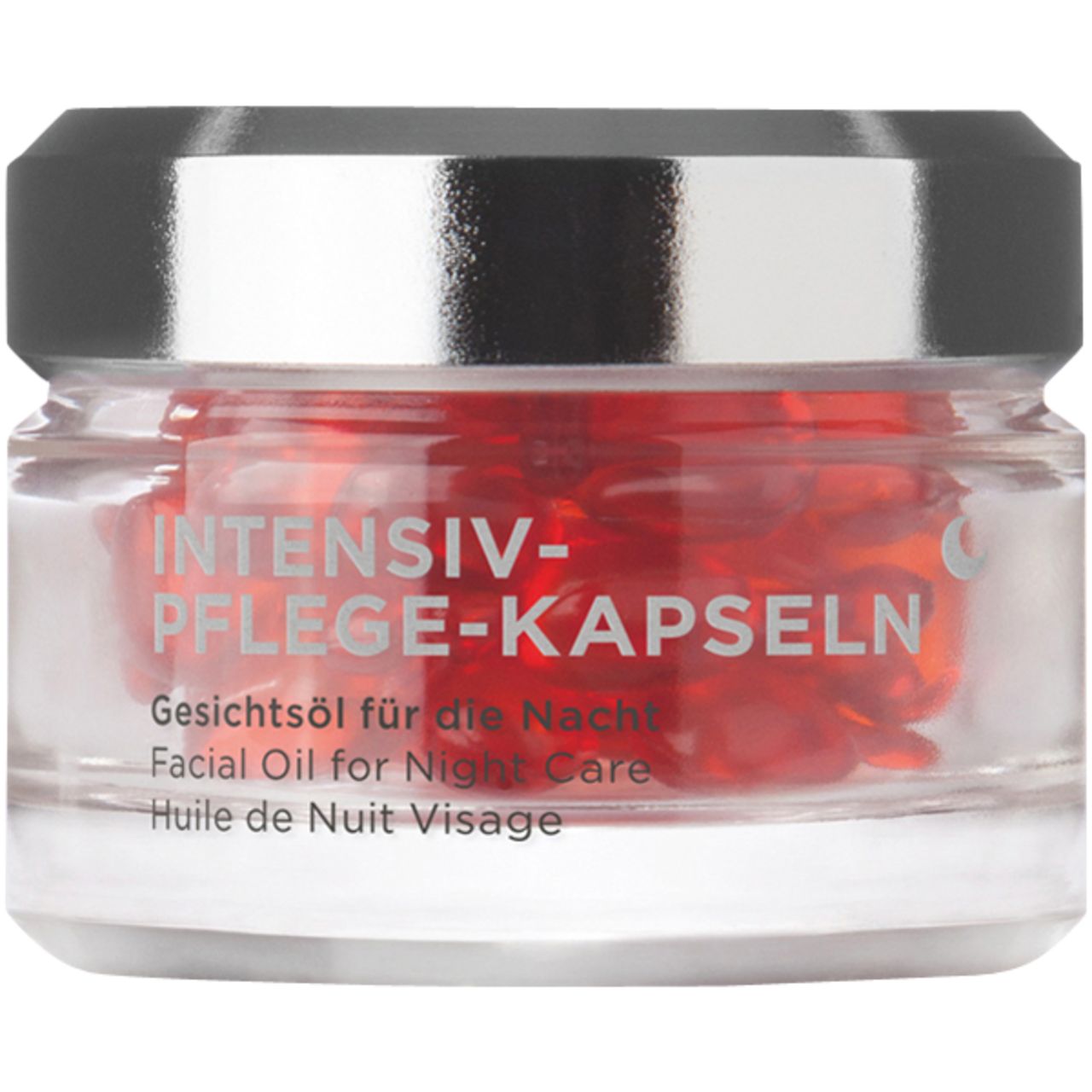 Glasbehälter mit roten Kapseln. Aufschrift: INTENSIV-PFLEGE-KAPSELN. Gesichtsol für die Nacht.