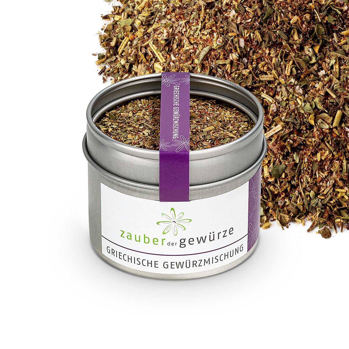 Geöffnete Dose mit griechischer Gewürzmischung. Weißes Etikett mit Logo und Schriftzug. Lila Band mit Text. Haufen Gewürze.