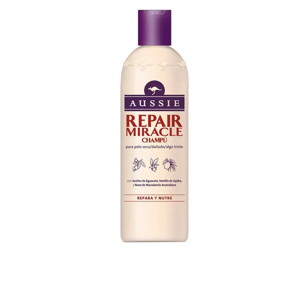 Beige Shampoo-Flasche mit lila Deckel. Aufschrift: Aussie Repair Miracle Champú. Enthält Avocado, Jojoba und Macadamia.