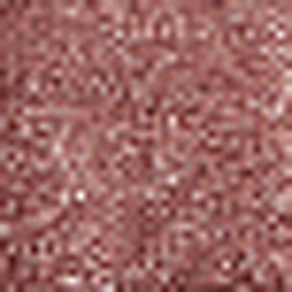 Textur eines schimmernden, bronzefarbenen Lidschattenstifts.
