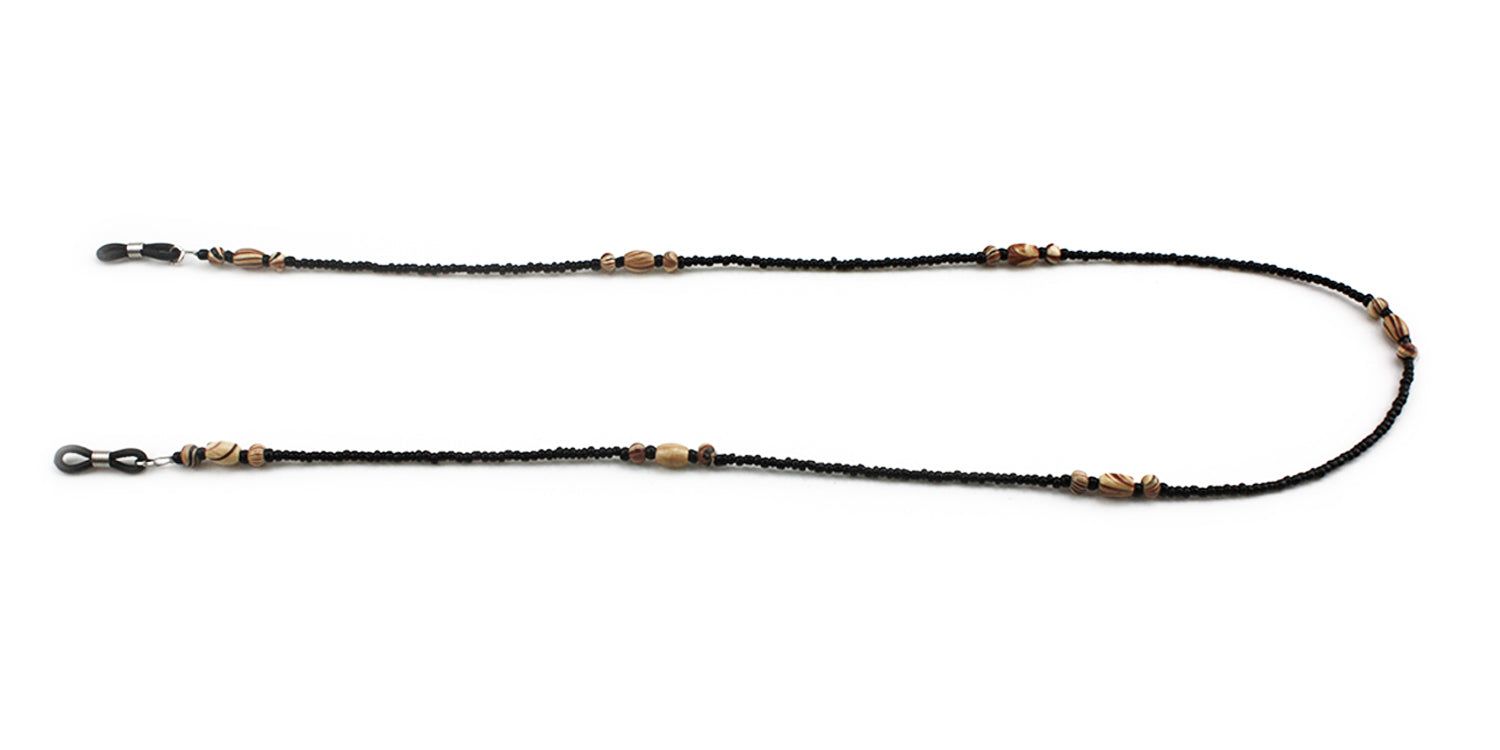 Brillenkette mit schwarzen Perlen und Holzperlen. Schwarze Gummischlaufen zur Befestigung an Brillenbügeln.