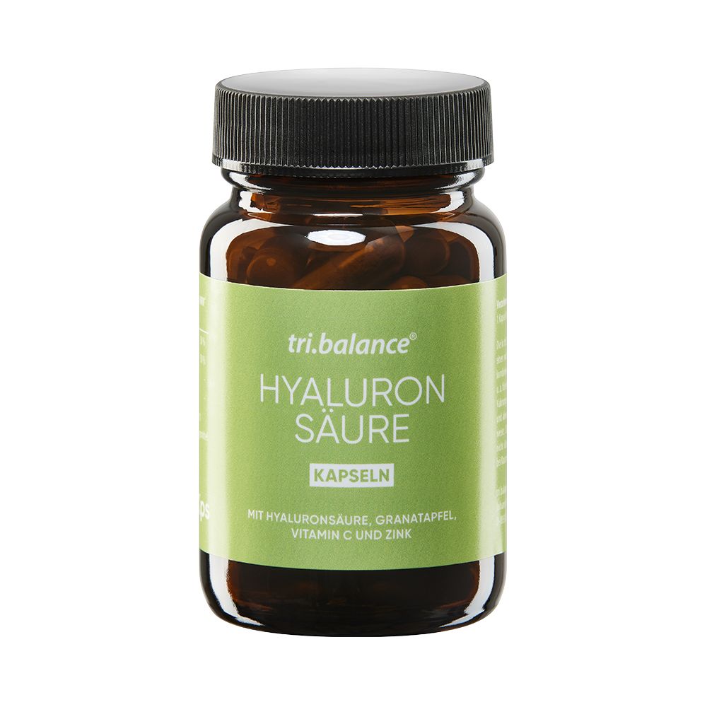 Braune Glasflasche mit schwarzem Deckel. Aufkleber mit "tri.balance HYALURON SÄURE Kapseln". Enthält Hyaluronsäure, Granatapfel, Vitamin C und Zink.