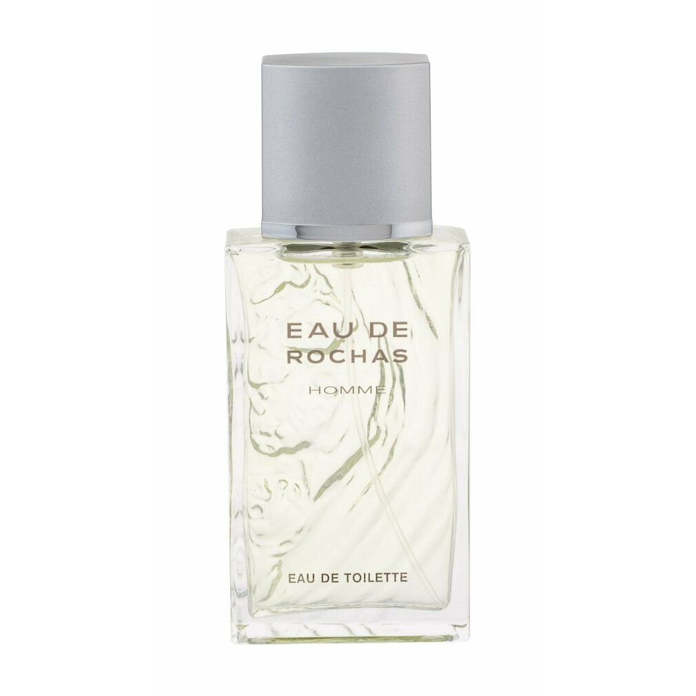 Eau de Rochas Flakon. Aufschrift: Eau de Rochas Homme, Eau de Toilette. Quadratische Form, silberner Deckel.
