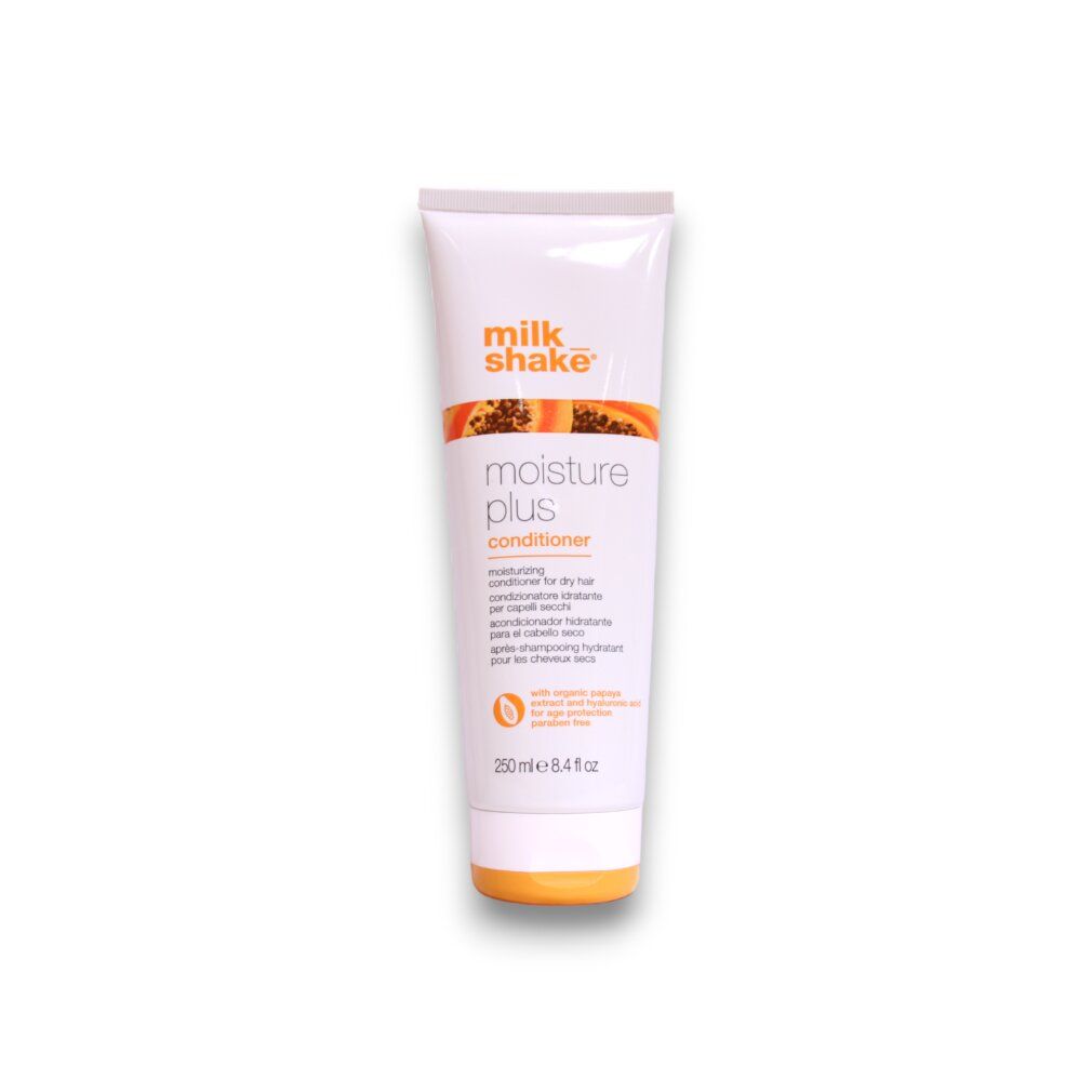 Weiße Tube mit orangefarbenem Deckel. Aufschrift: milk_shake moisture plus conditioner. Text in mehreren Sprachen.