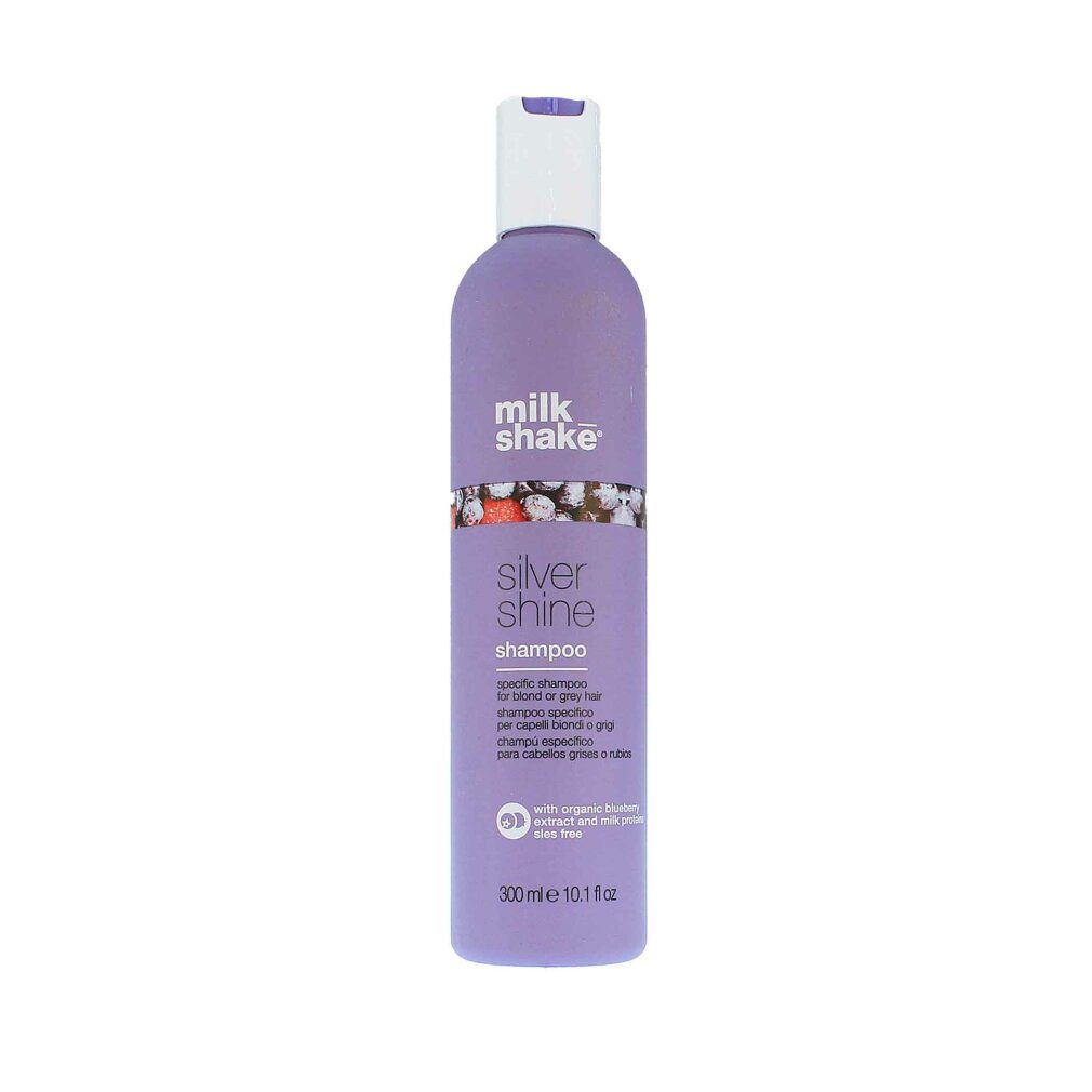 Lila Shampoo-Flasche mit weißem Deckel. Aufschrift: milk_shake, Silver Shine Shampoo. Mehrsprachiger Text.