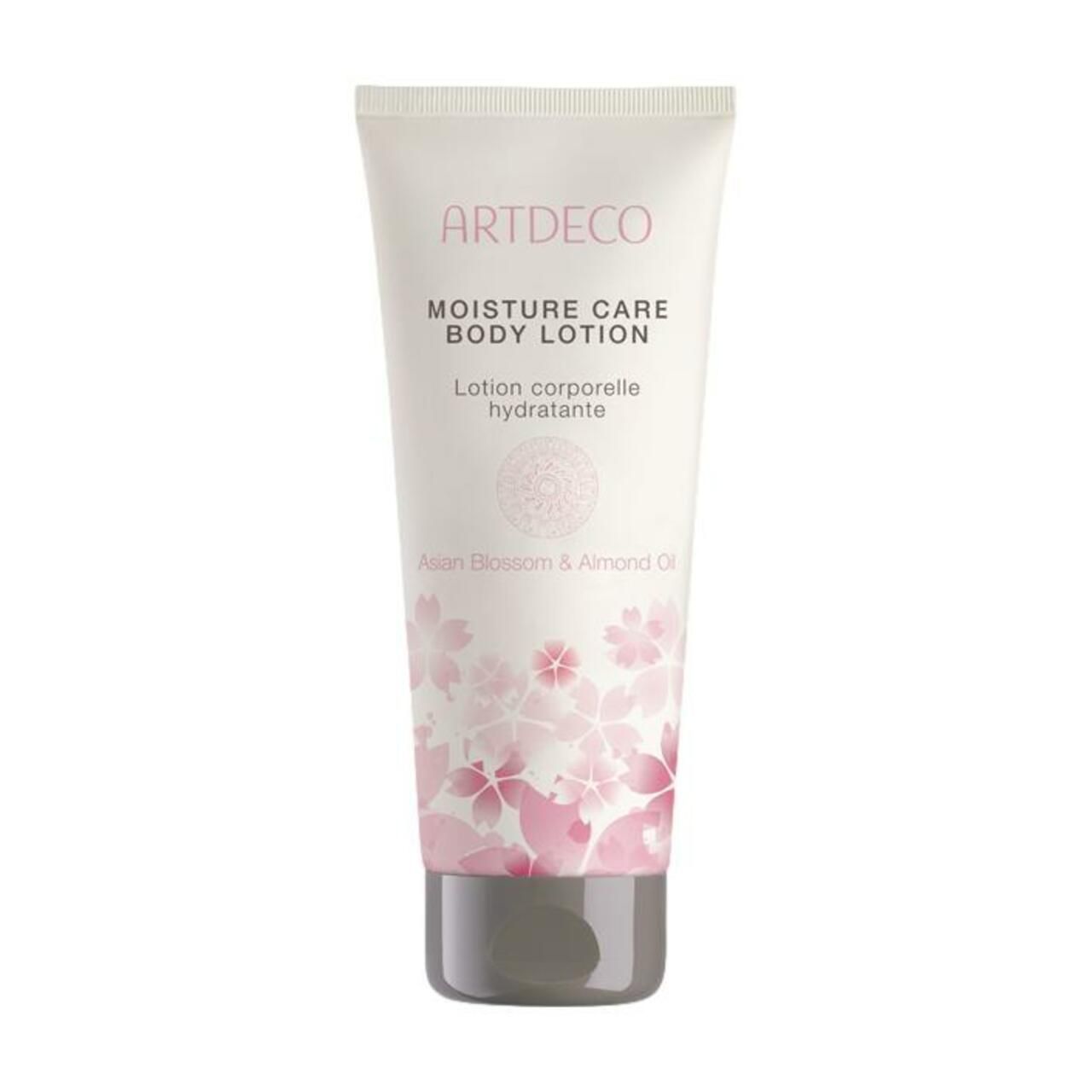 Creme-Tube mit Aufschrift ARTDECO, Moisture Care Body Lotion. Blütenmuster und grauer Verschluss.