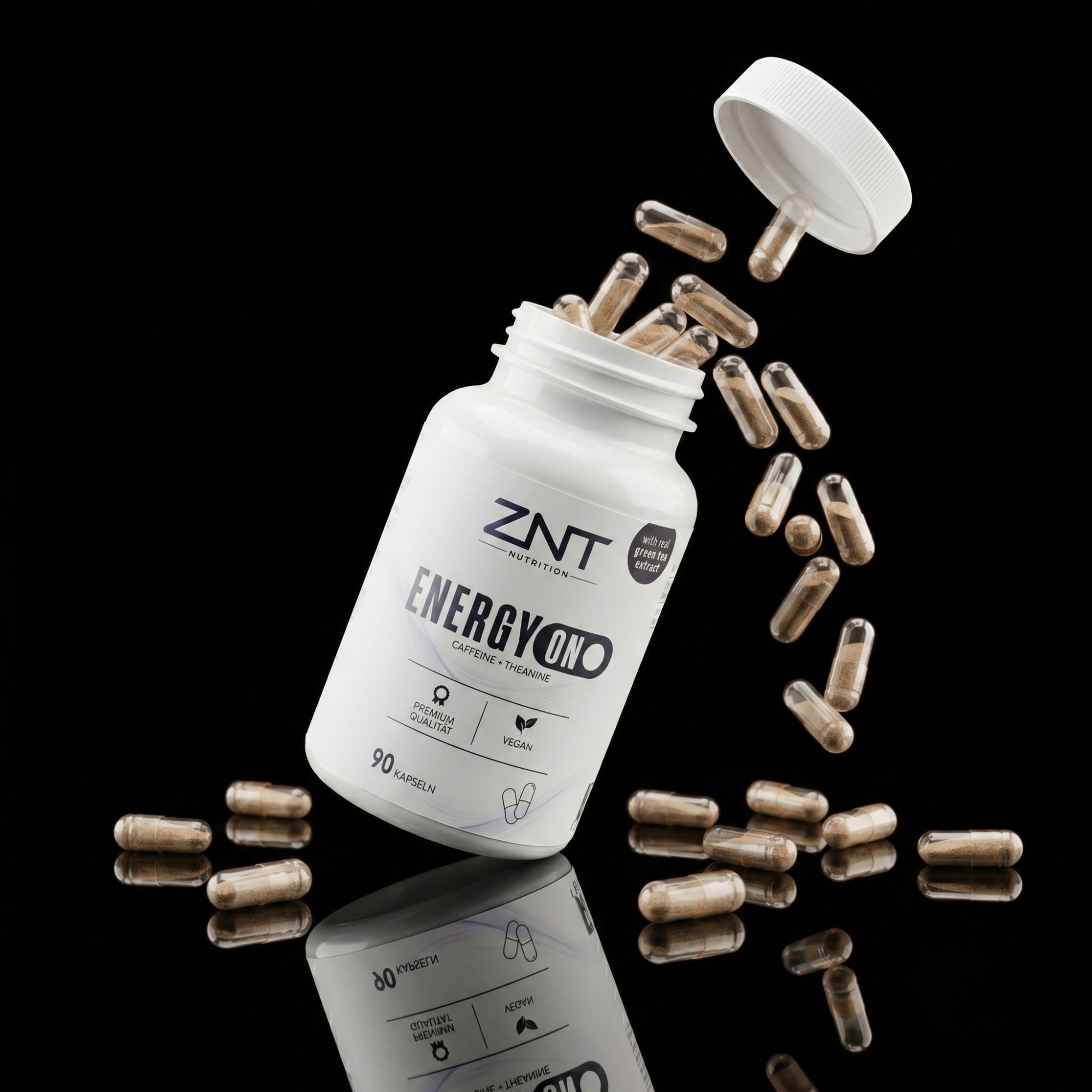 Weiße Kapsel-Flasche mit ZNT Nutrition Energy ON Etikett, Kapseln fliegen heraus. Enthält 90 Kapseln.