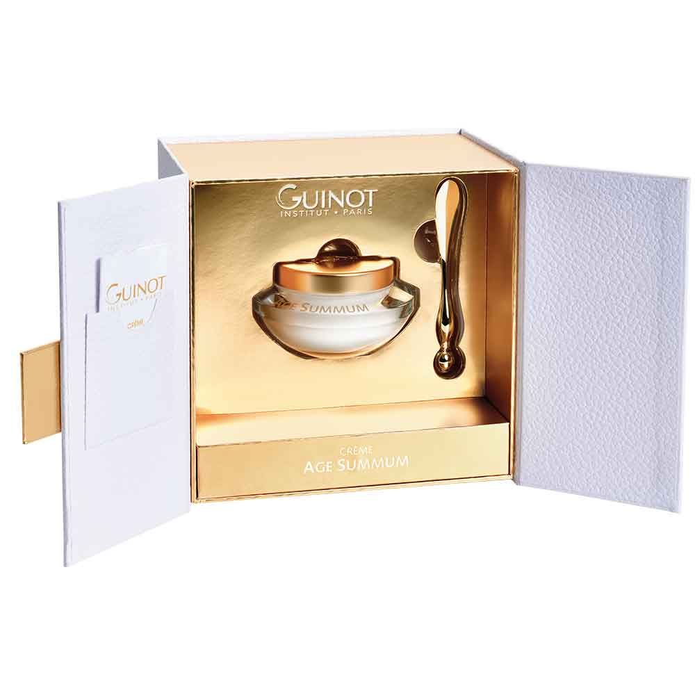 Geschenkbox mit Creme und Applikator. Goldfarbene Innenausstattung. Aufschrift Guinot und Age Summum.