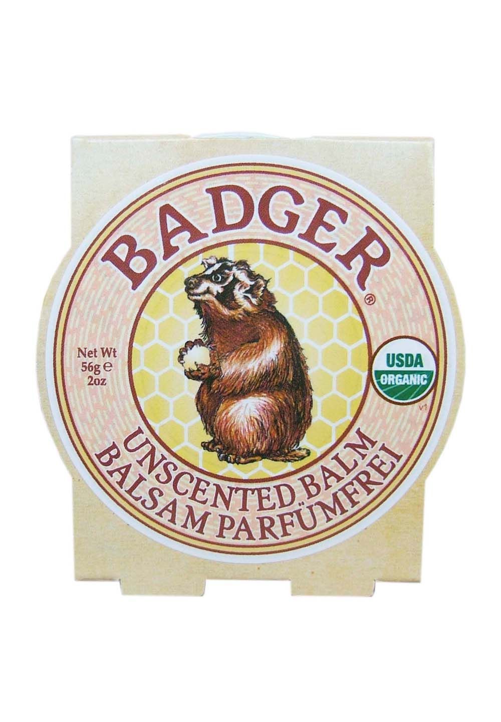 Runde Verpackung mit Bär-Illustration. Text: BADGER, UNSCENTED BALM, BALSAM PARFUMFREI. USDA Organic-Siegel.