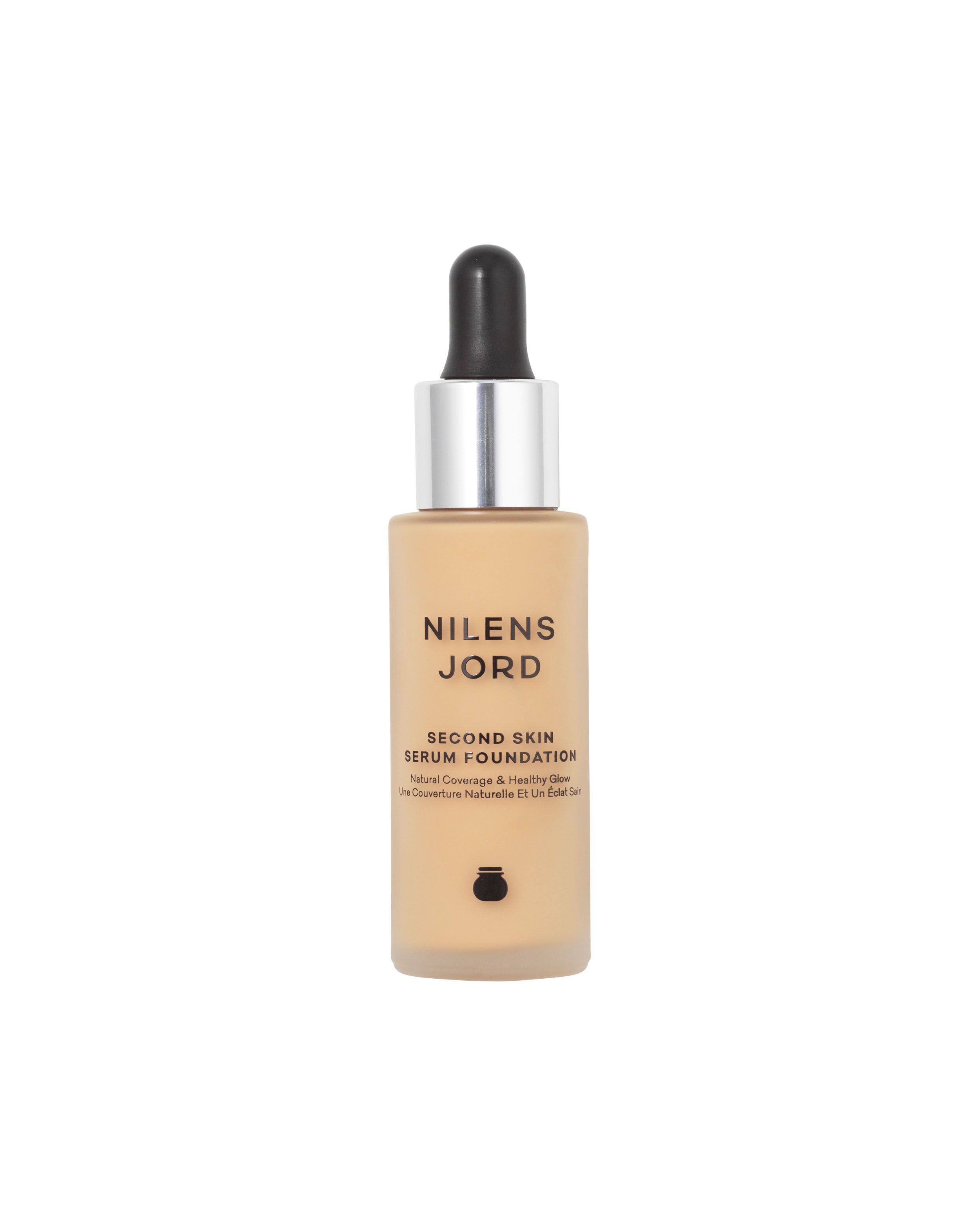 Nilens Jord Second Skin Serum Foundation in einem Glasfläschchen mit Pipettenverschluss. Helle Hautfarbe.