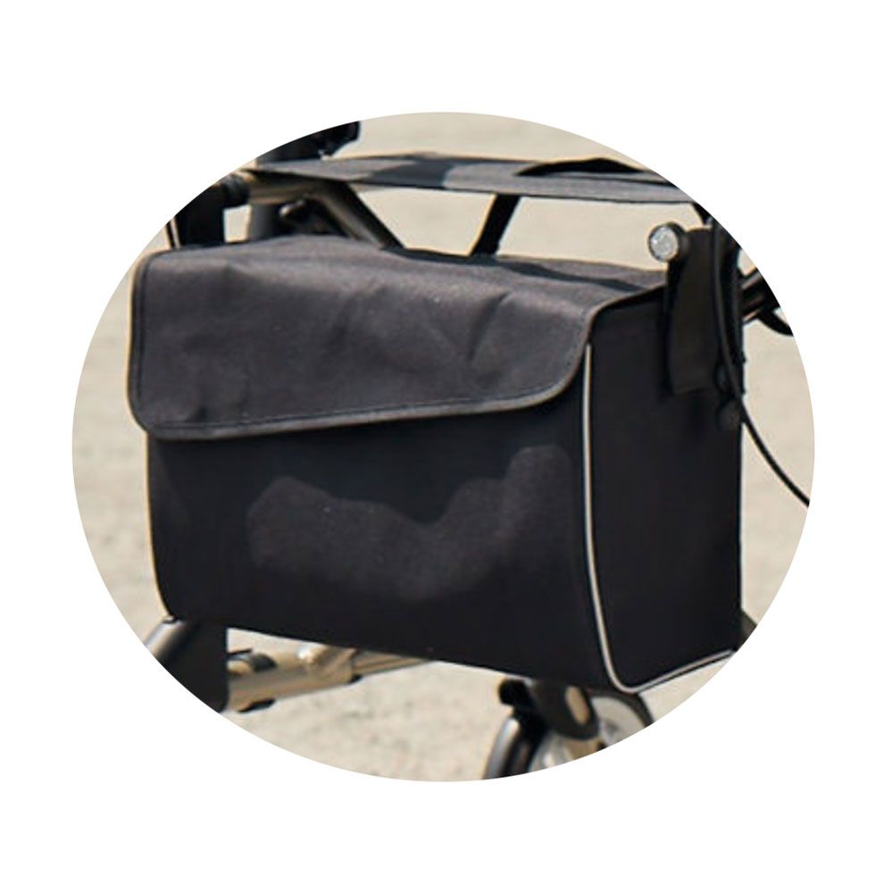 Schwarze Tasche mit Magnetverschluss für Rollator. Rechteckige Form, weißer Rand. An Rollator befestigt.