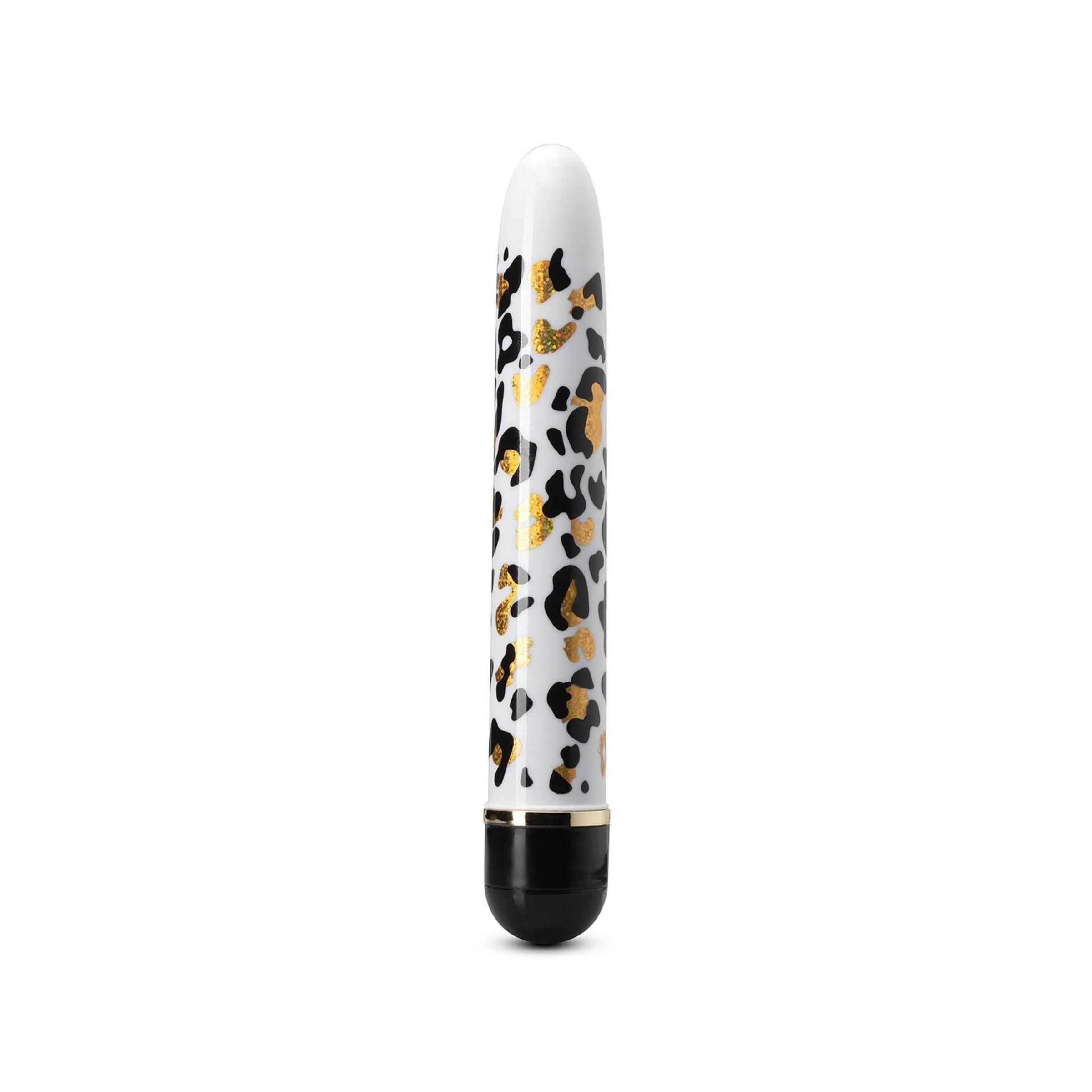 Weißer Vibrator mit Leopardenmuster und schwarzem Ende. Goldene Akzente. Zylindrische Form.