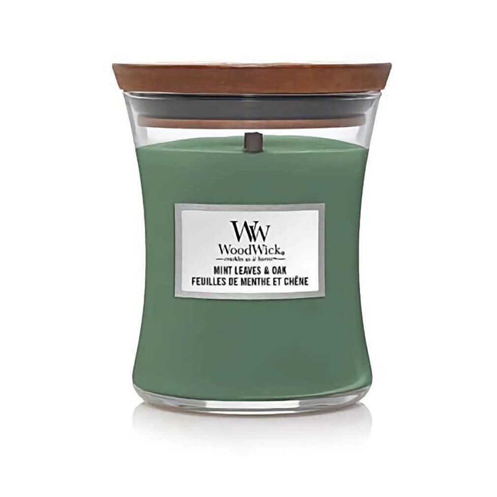 Grüne Sanduhrkerze mit Holzdeckel. Aufschrift: WoodWick, Mint Leaves & Oak. Glasbehälter.