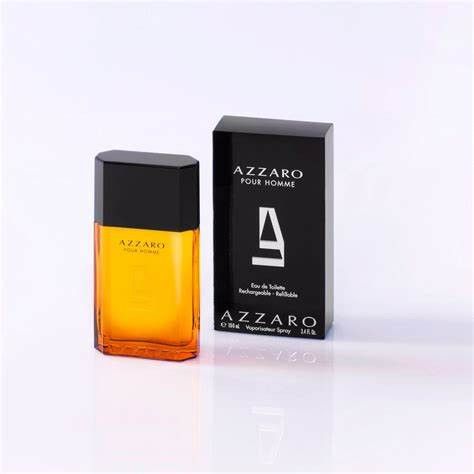 AZZARO POUR HOMME Eau de Toilette Spray. Rechteckiger Flakon mit schwarzem Deckel und Verpackung.