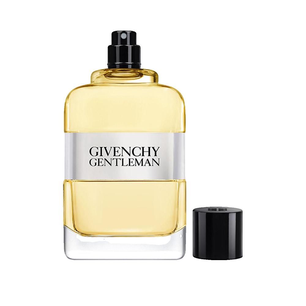 Givenchy Gentleman Eau de Toilette Flakon mit abgenommenem Verschluss. Rechteckige Form, gelbe Flüssigkeit, schwarzer Verschluss.