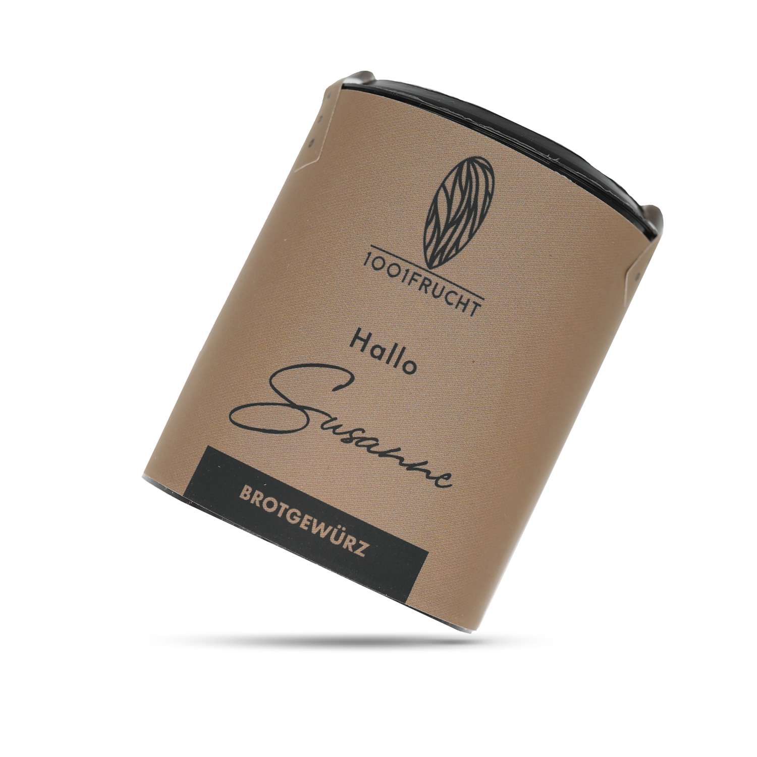 Zylindrische Verpackung mit Aufschrift "1001 Frucht", "Hallo Susanne", und "Brotgewürz". Braune Verpackung, schwarzer Deckel.