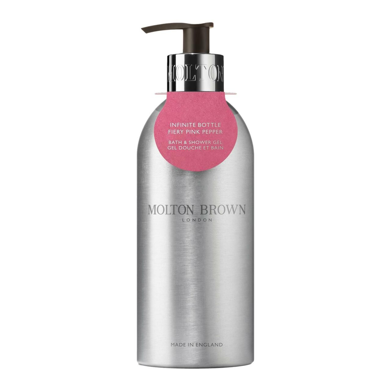Zylindrische, silberfarbene Flasche mit schwarzem Pumpkopf. Rosa Etikett mit Produktinformationen. Marke: Molton Brown.