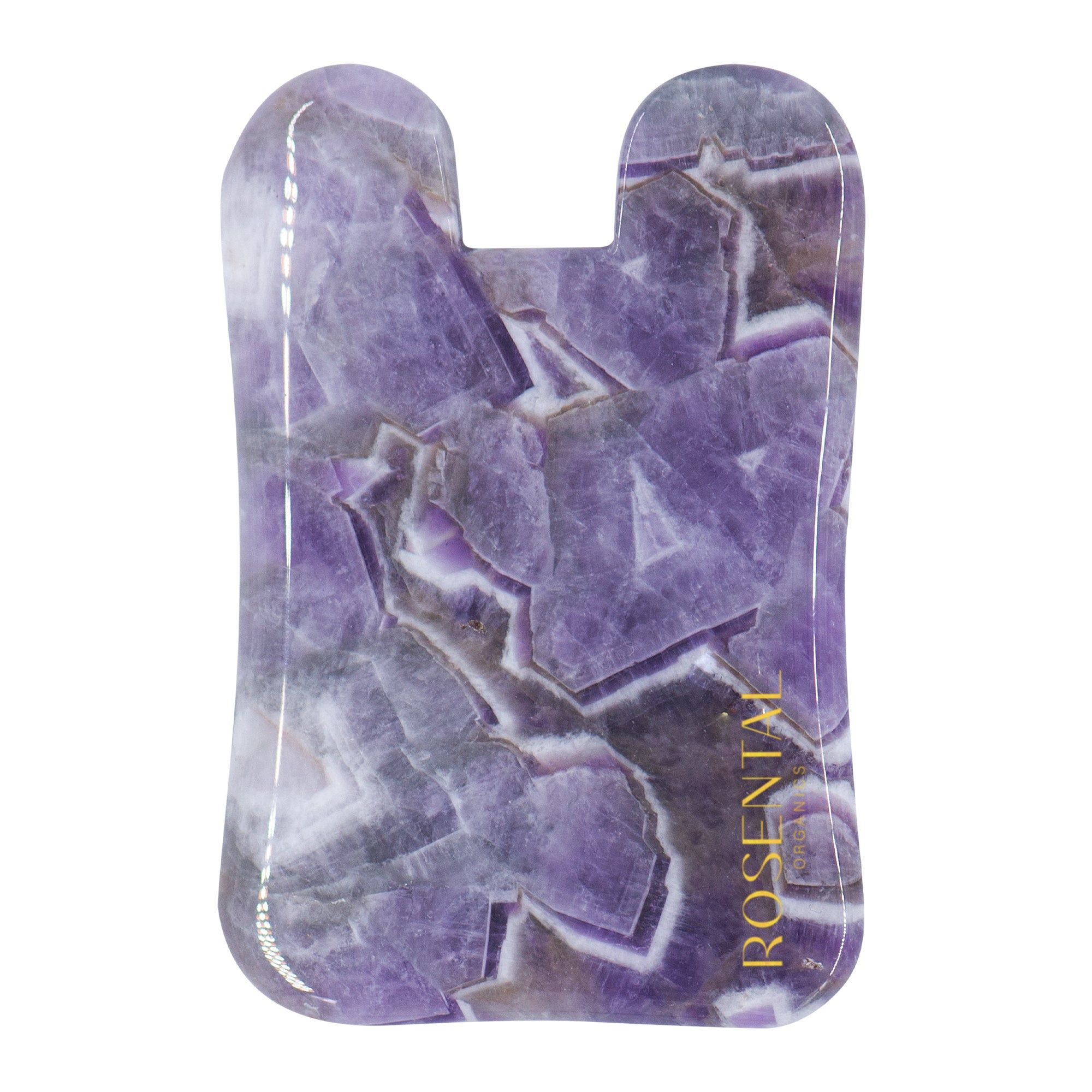 Amethyst Gua Sha. Lila Stein mit goldfarbenem Logo. Form: abgerundetes Rechteck mit zwei Aussparungen.