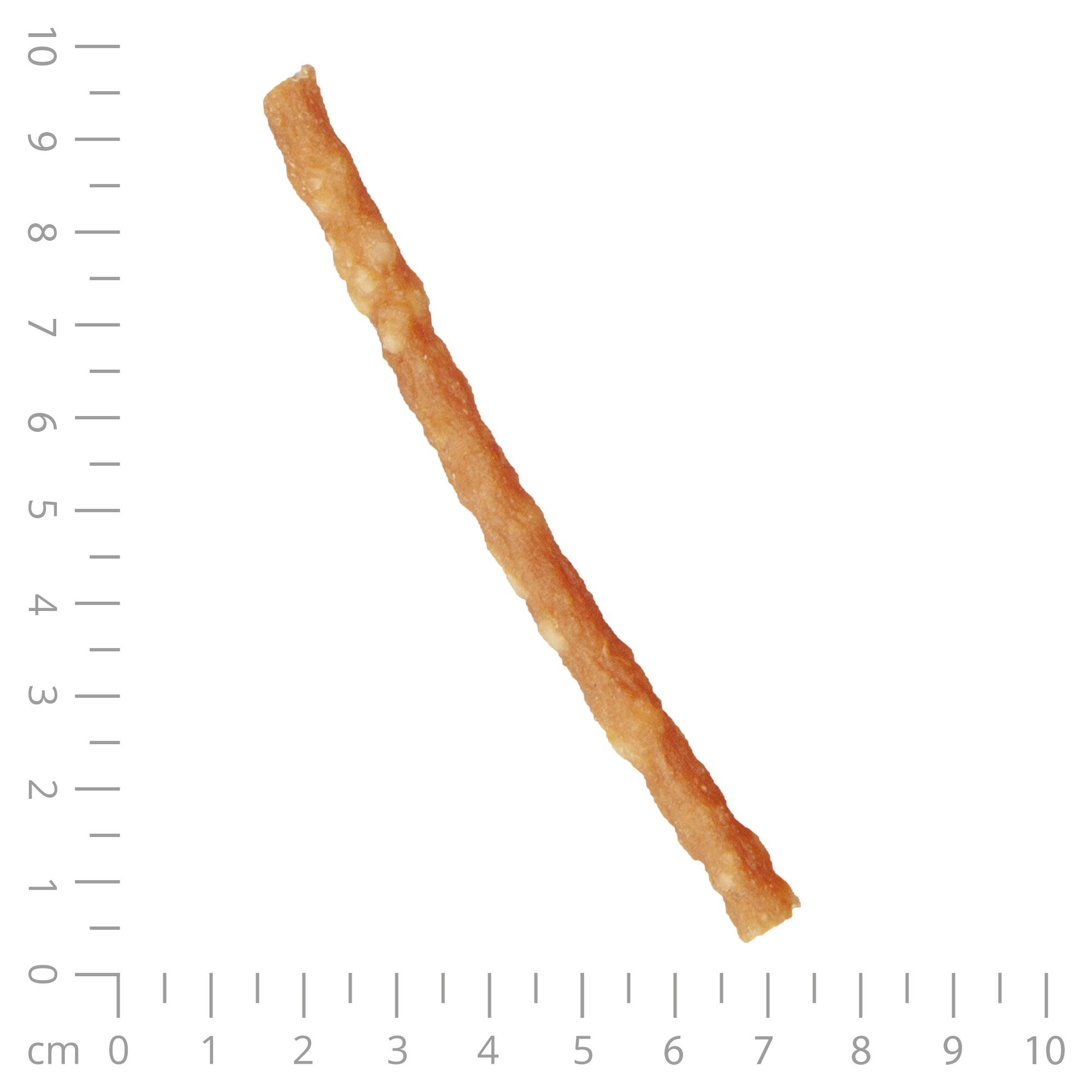 Ein einzelner, länglicher Hundesnack. Der Snack ist beige und hat eine unregelmäßige Oberfläche. Ein Lineal liegt daneben.