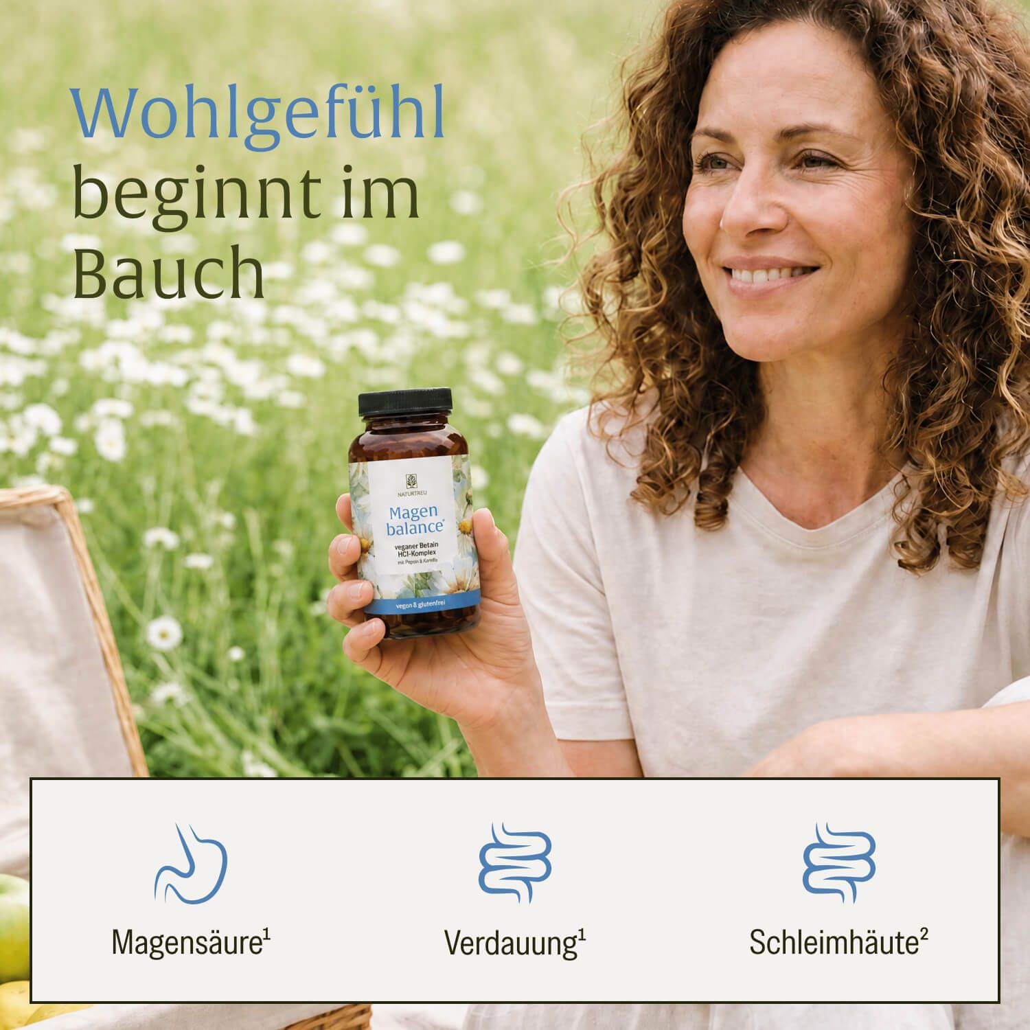 Frau hält eine Flasche "Magen balance" im Freien. Symbole für Magen, Verdauung und Schleimhäute.
