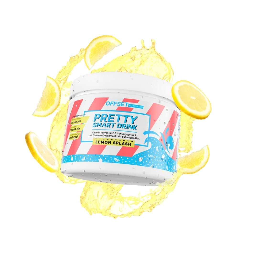 Weißes Produktglas mit roter und blauer Grafik. Aufschrift: Pretty Smart Drink Lemon Splash. Zitronenscheiben und Spritzer.