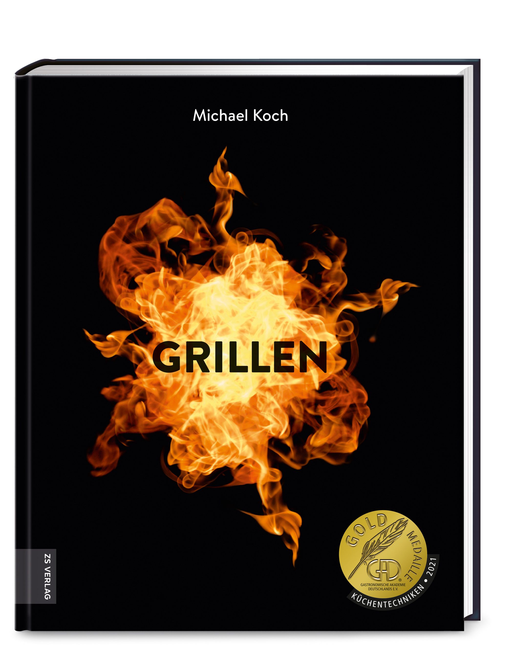 Buch mit schwarzem Einband. Titel: GRILLEN. Autor: Michael Koch. Abbildung von Flammen. Goldmedaille für Küchentechniken.