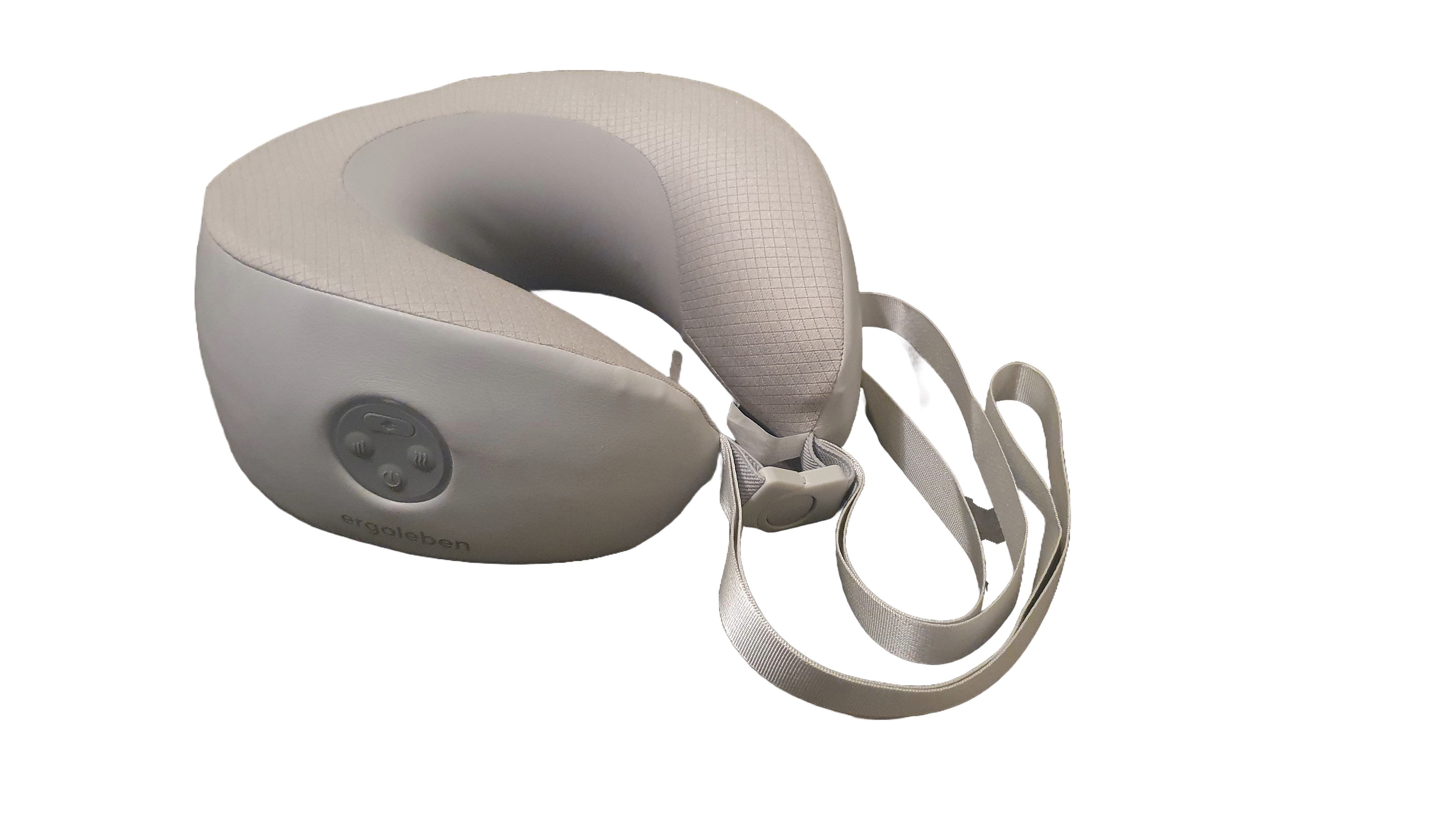 Graues Nackenmassagekissen mit Bedienfeld und Trageriemen. Das Kissen hat eine ergonomische Form.