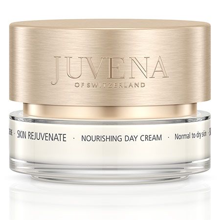 Creme-Tiegel mit goldfarbenem Deckel. Auf dem Deckel steht "JUVENA OF SWITZERLAND". Auf dem Etikett steht "SKIN REJUVENATE NOURISHING DAY CREAM".