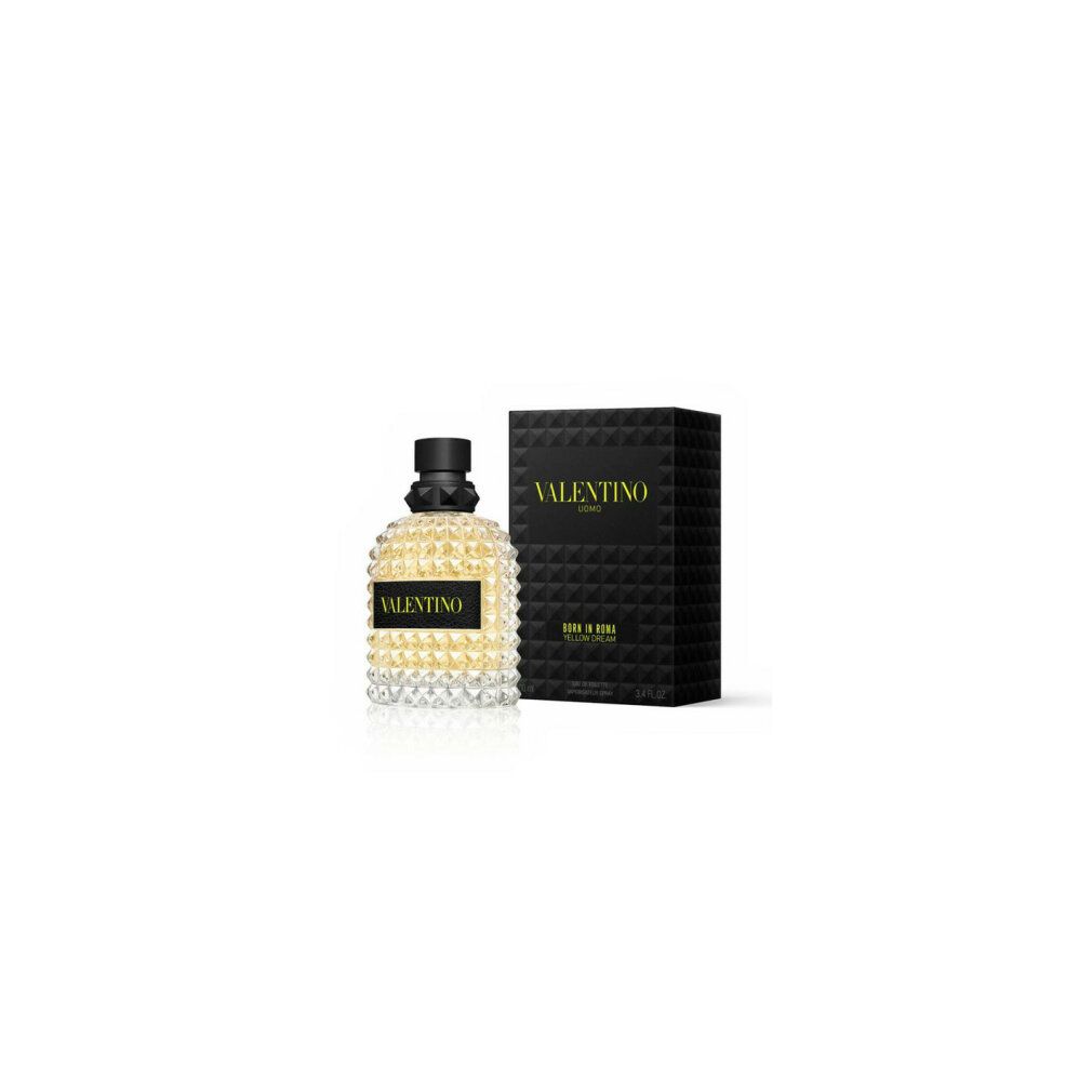 Valentino Uomo Born in Roma Yellow Dream Flakon und Verpackung. Schwarze Kappe, gelbe Flüssigkeit, schwarze Verpackung mit gelber Schrift.