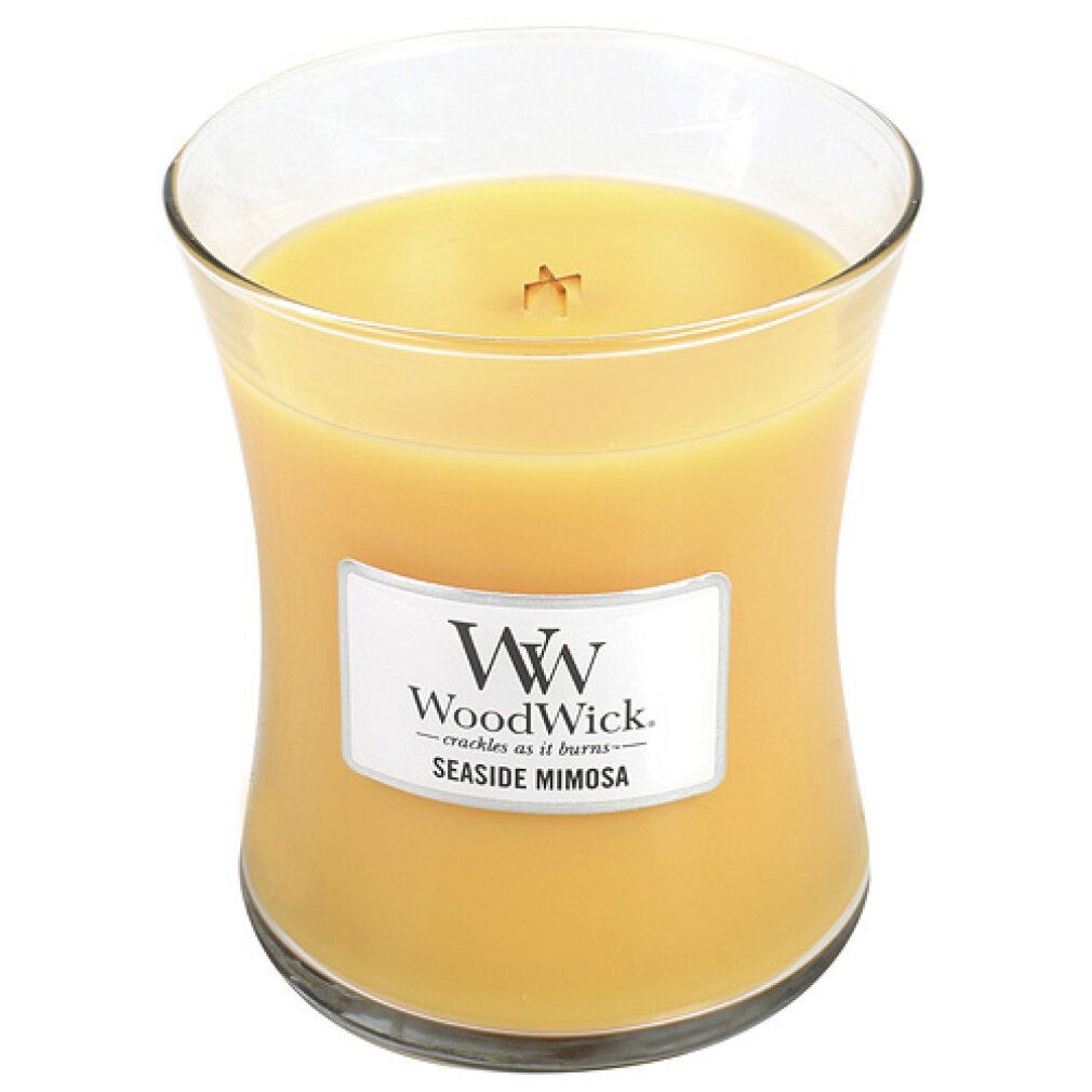 Sanduhrförmige Kerze. Aufkleber "WoodWick Seaside Mimosa". Gelbes Wachs in Glasbehälter. Docht sichtbar.