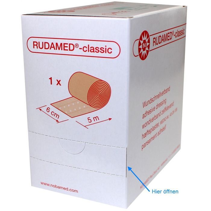Rudamed-classic Wundpflaster-Verpackung. Aufschrift: Wundschnellverband, 6 cm x 5 m. Pfeil: Hier öffnen.