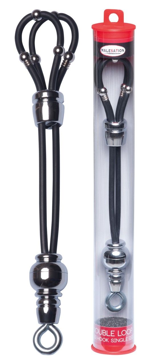 Schwarzes Produkt mit zwei Schlaufen, Metallkugeln und Haken. In transparenter Röhre mit rotem Deckel. Markenlogo sichtbar.