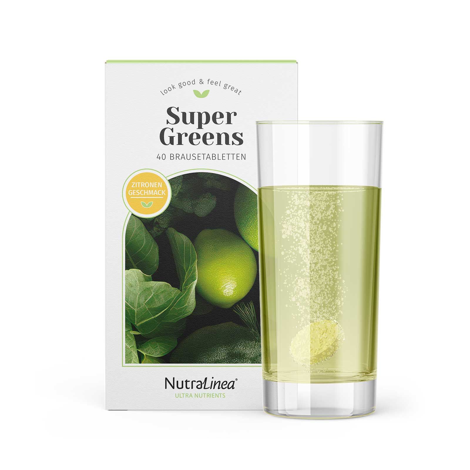 Glas mit gelöster Super Greens Brausetablette. Daneben die Produktverpackung mit Zitronen-Geschmack.