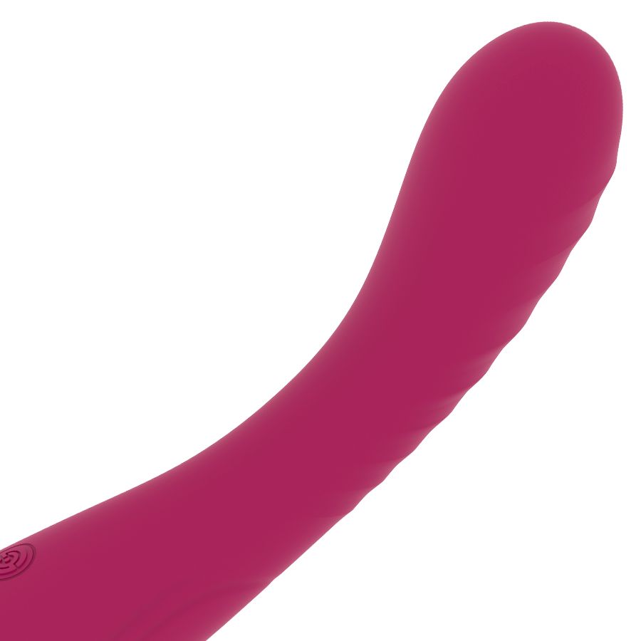 Nahaufnahme eines pinkfarbenen G-Punkt-Vibrators. Geschwungene Form, abgerundete Spitze.