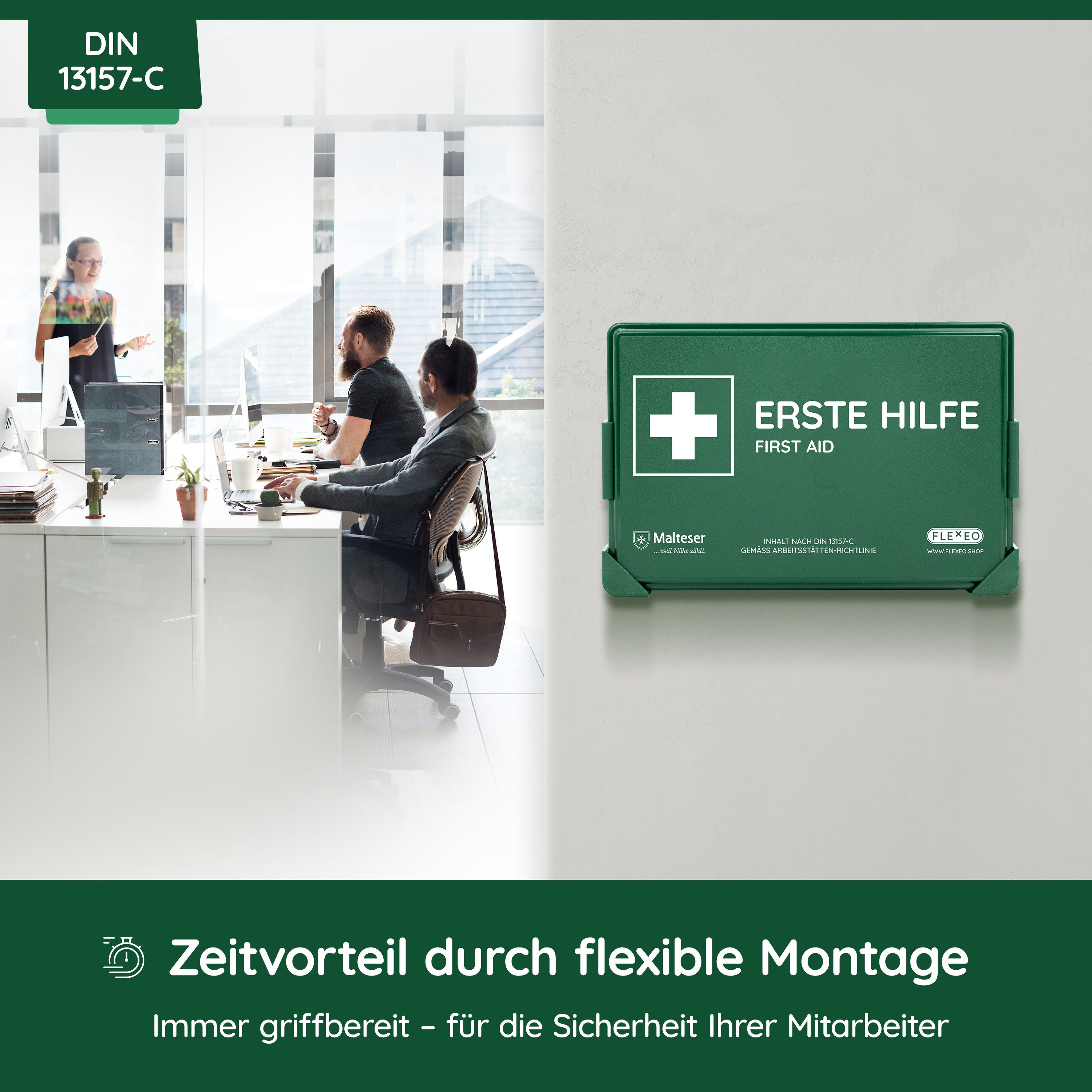 Grüner Verbandskasten mit weißem Kreuz und Aufschrift "ERSTE HILFE".  Im Hintergrund Personen im Büro.