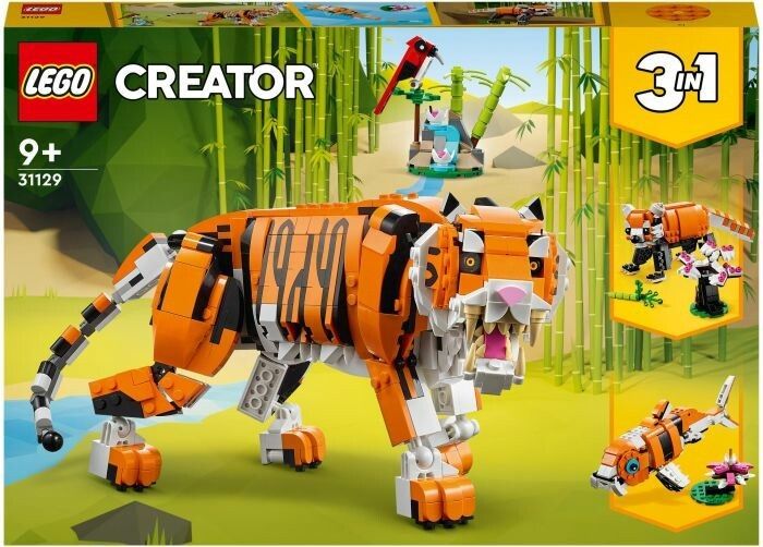 Set LEGO Creator 3 in 1 con una maestosa tigre. Il set include mattoncini per costruire una tigre, un pesce e un uccello rosso. La confezione mostra la tigre in un ambiente giungla. Adatto a bambini dai 9 anni in su.