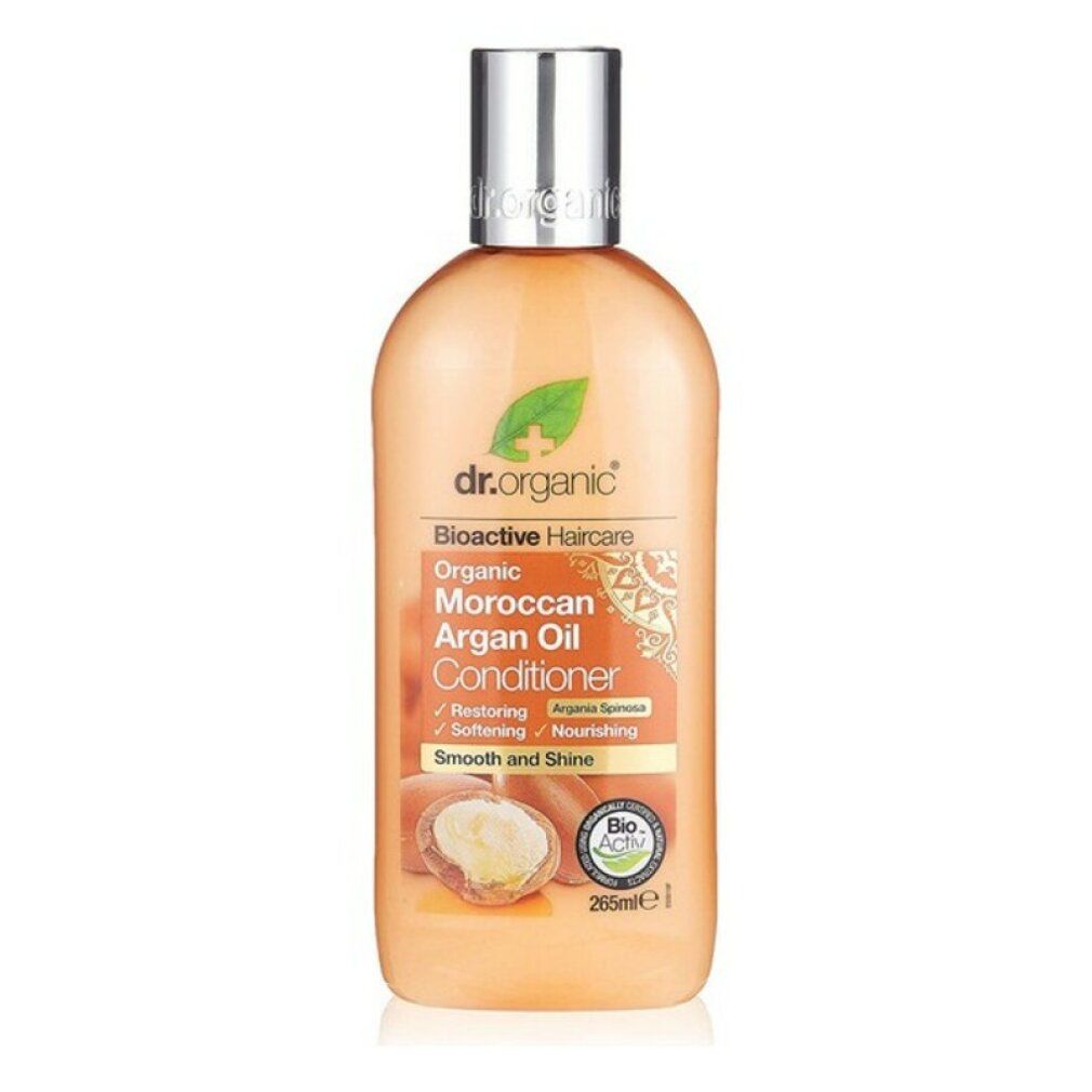 Flasche mit Conditioner. Aufschrift: Dr. Organic, Bioaktive Haarpflege, Moroccan Argan Oil Conditioner. Silberner Deckel.