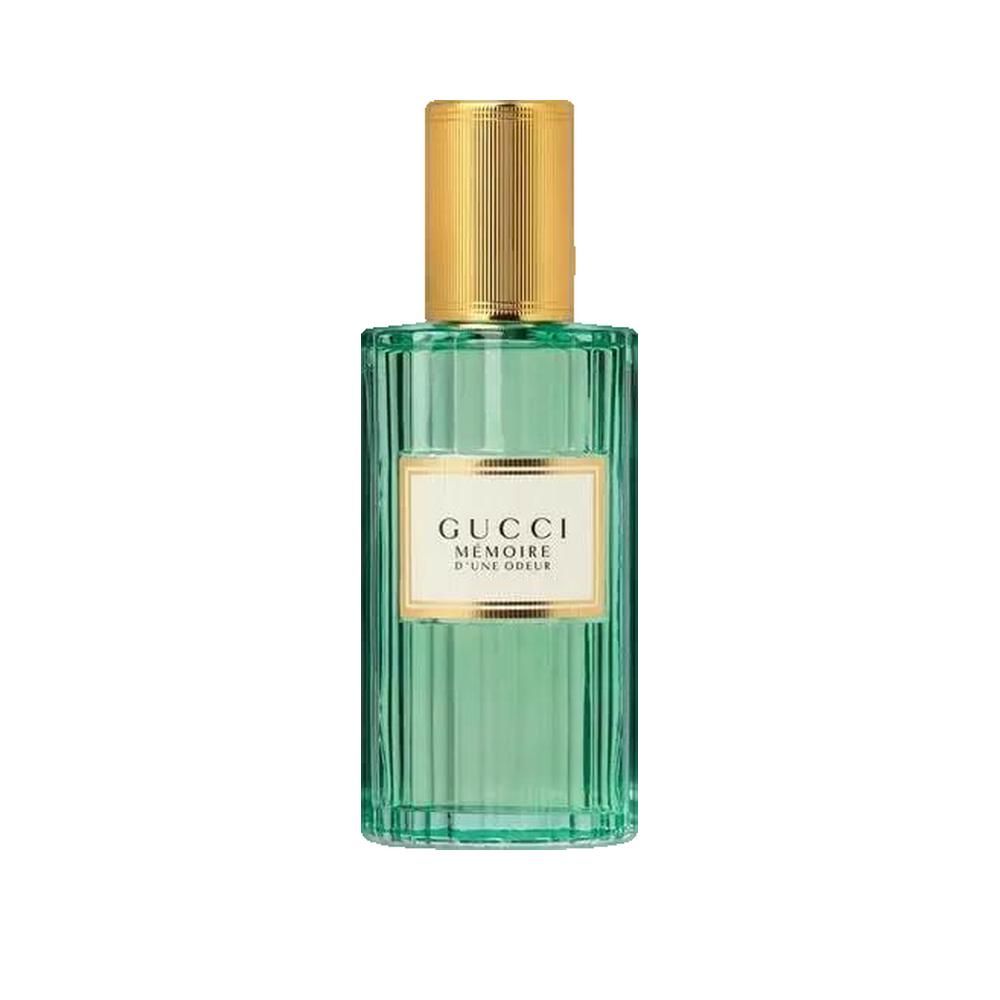 Grünes Glasparfüm mit goldfarbenem Deckel. Etikett mit Schriftzug Gucci Mémoire d'une Odeur.