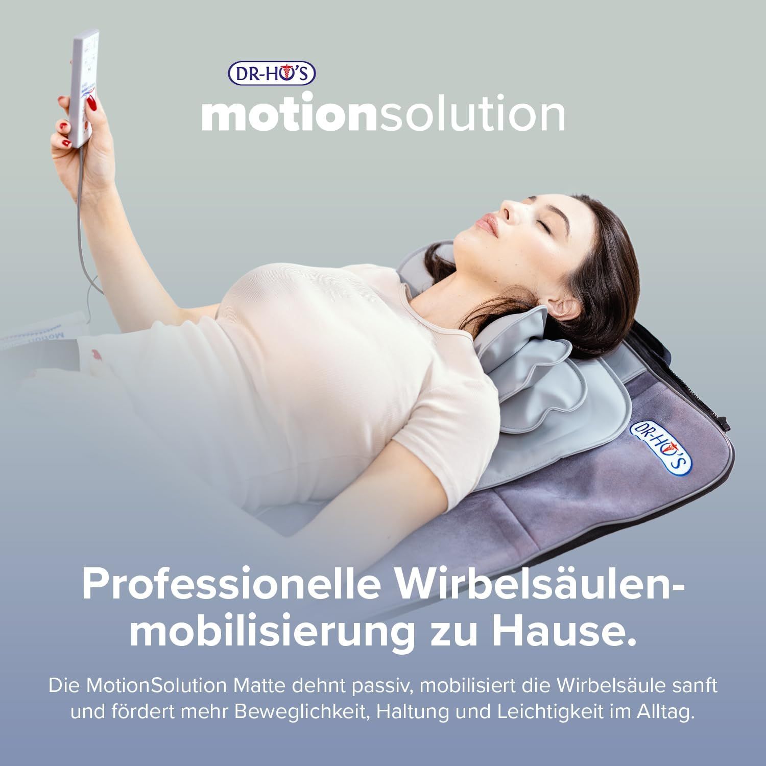 DR-HO'S MotionSolution Matte mit rotem und blauem Polster, auf einer grauen Unterlage.