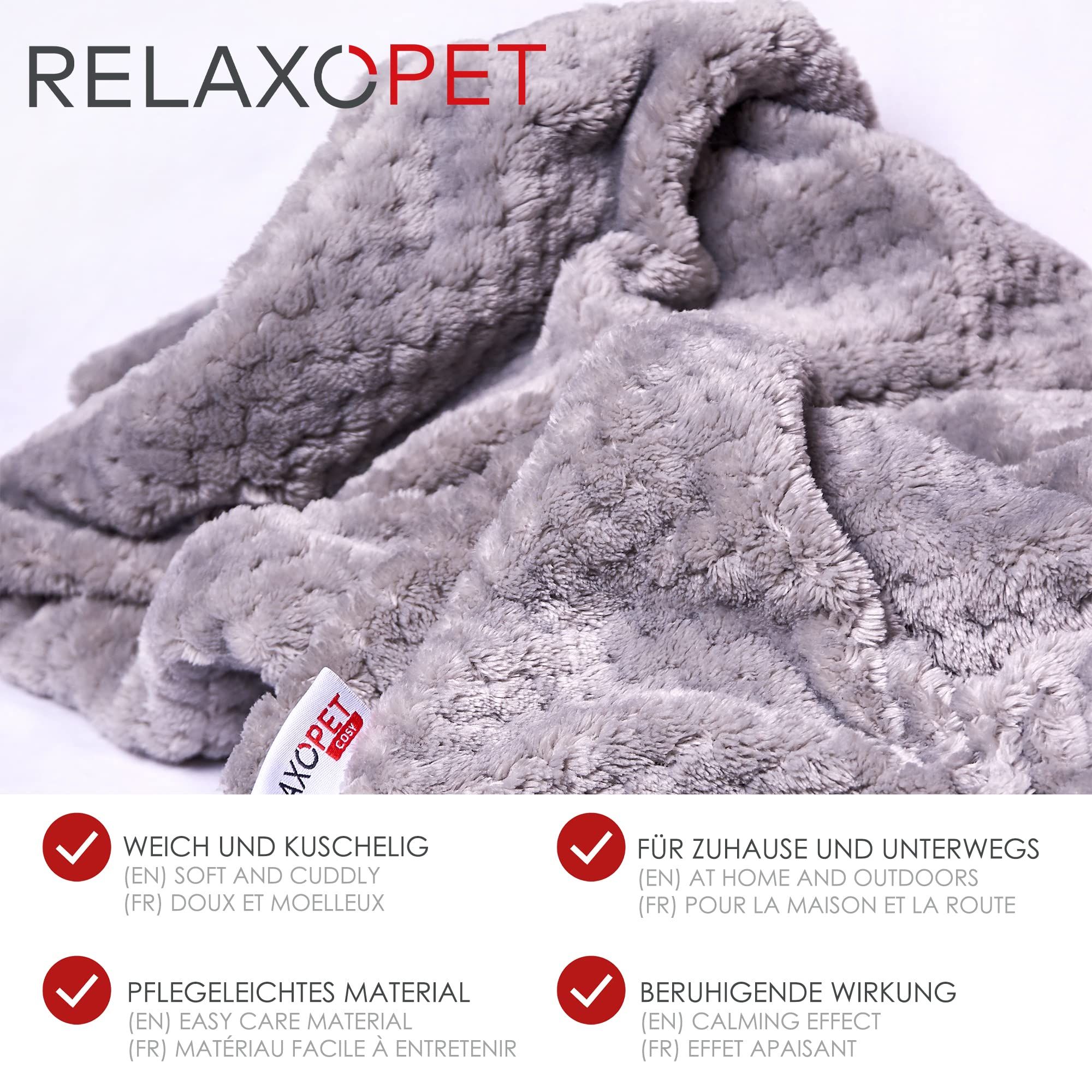 Graue, kuschelige Decke mit RelaxoPet-Logo. Text: Weich und kuschelig, pflegeleicht, für Zuhause und unterwegs, beruhigende Wirkung.
