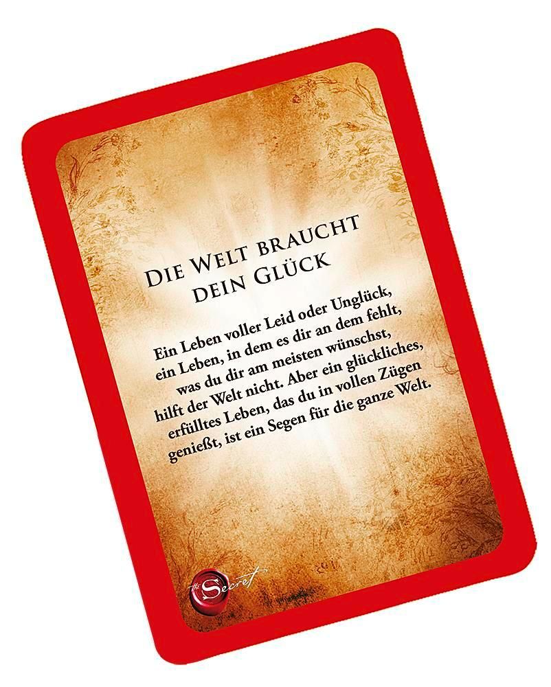 Karte mit rotem Rand und Text. Titel: "Die Welt braucht dein Glück". Text in deutscher Sprache. Brauner Hintergrund.