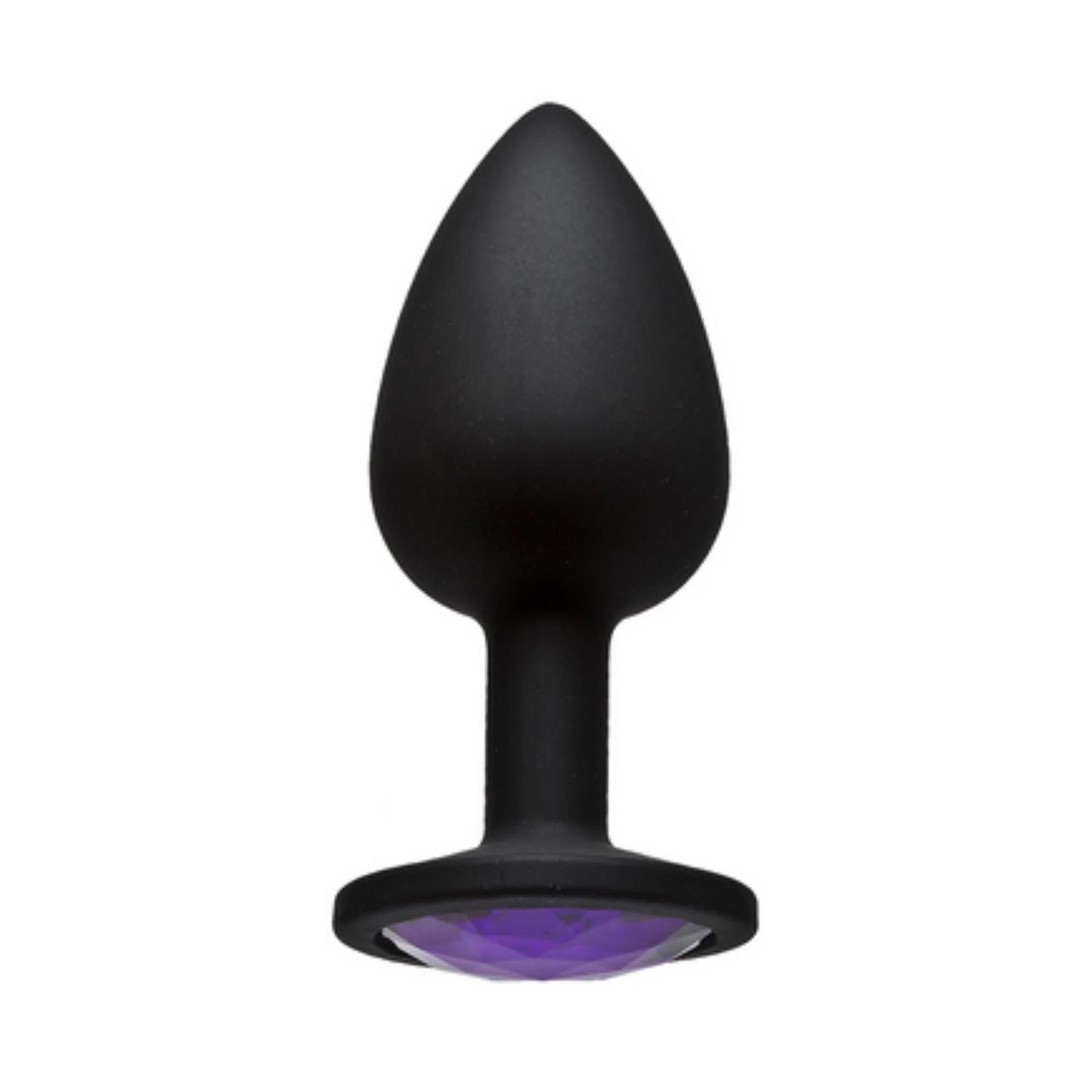 Schwarzer Butt Plug mit lila Schmuckstein. Tropfenförmige Spitze, runde Basis.