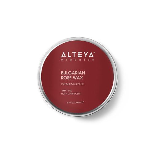 Runde Dose mit rotem Deckel. Aufschrift: Alteya Organics, Bulgarian Rose Wax, Premium Grade.