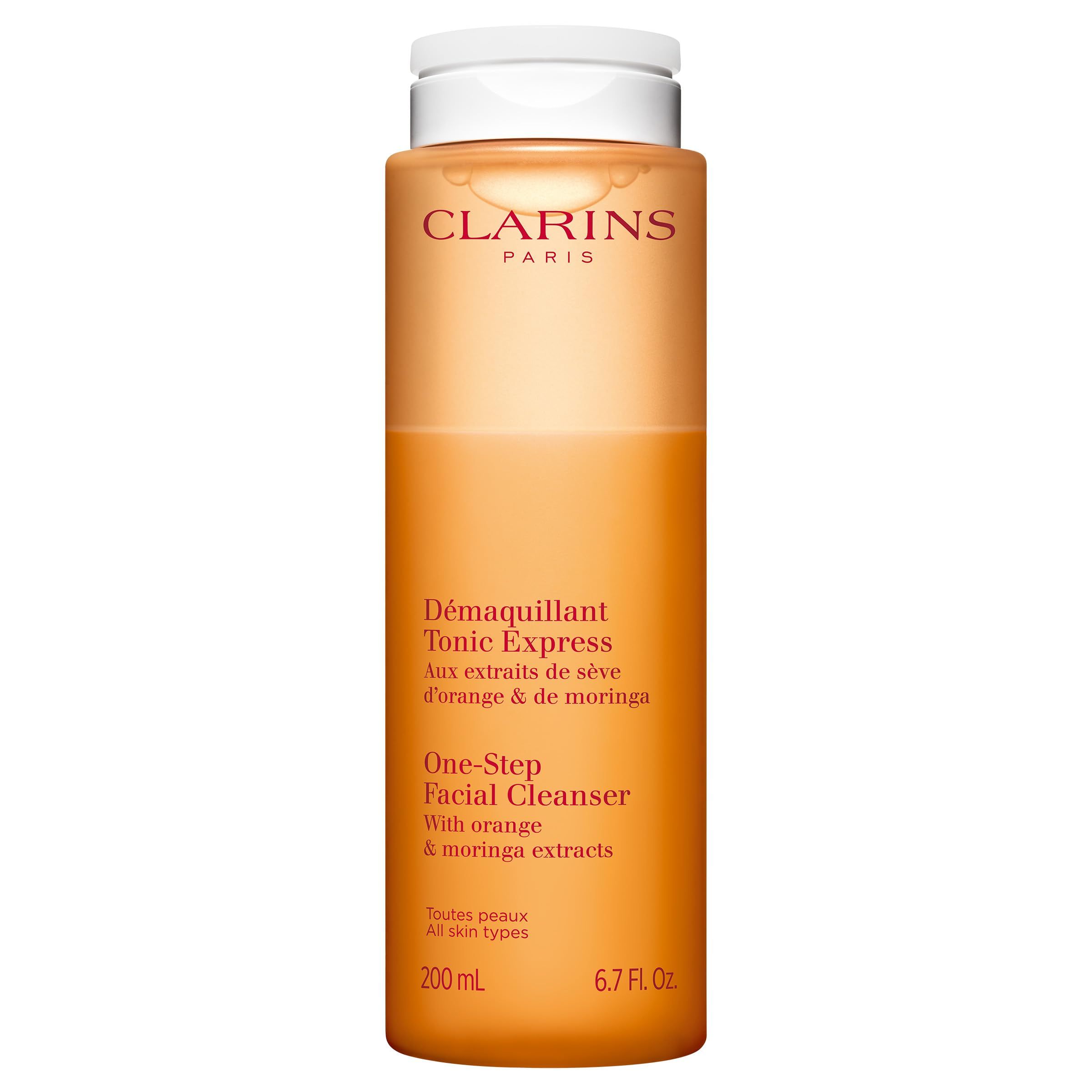 Orangefarbene Clarins Tonic Express Flasche. Mit Orangen- und Moringe-Extrakten. Weiße Kappe.