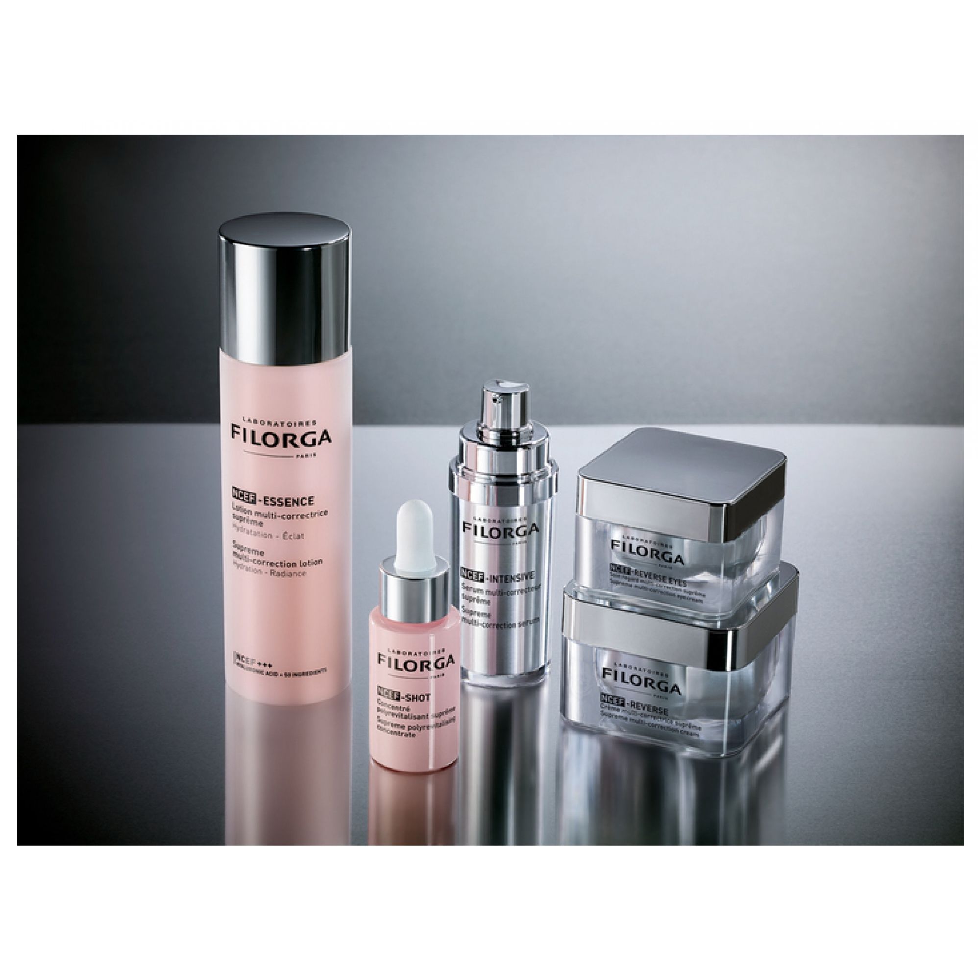Filorga Hautpflegeprodukte: Essence, Shot, Intensive und Reverse in Glasbehältern mit silbernen Verschlüssen.